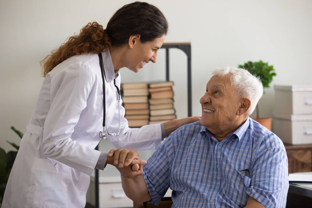 A Doctor Is Talking to the Elderly Patient